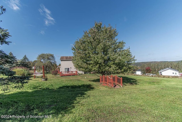 view of yard with a wooden deck