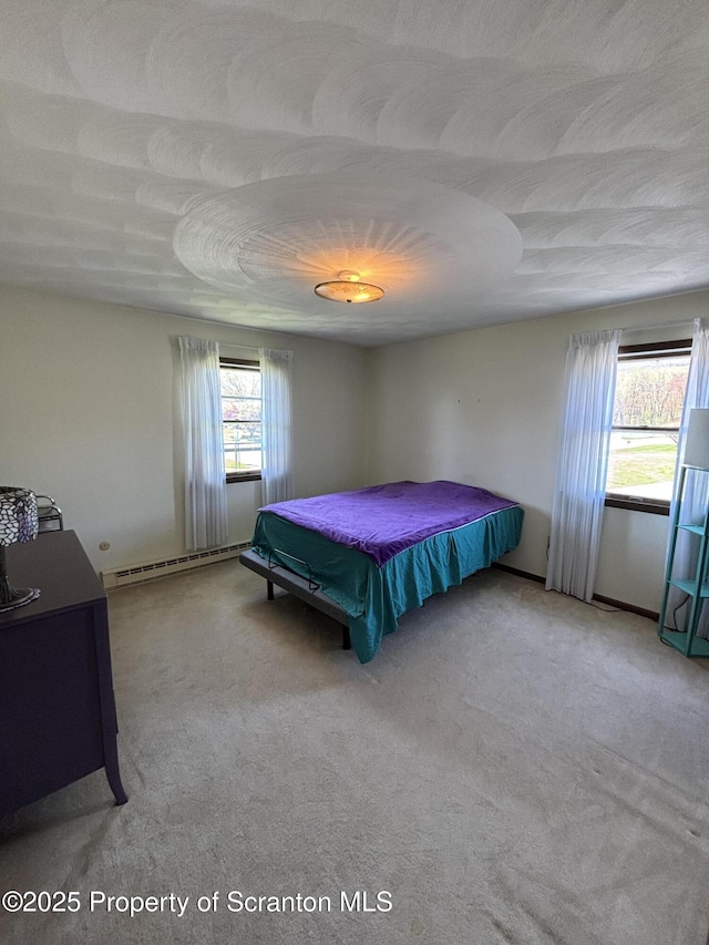 bedroom featuring carpet, billiards, and a baseboard heating unit