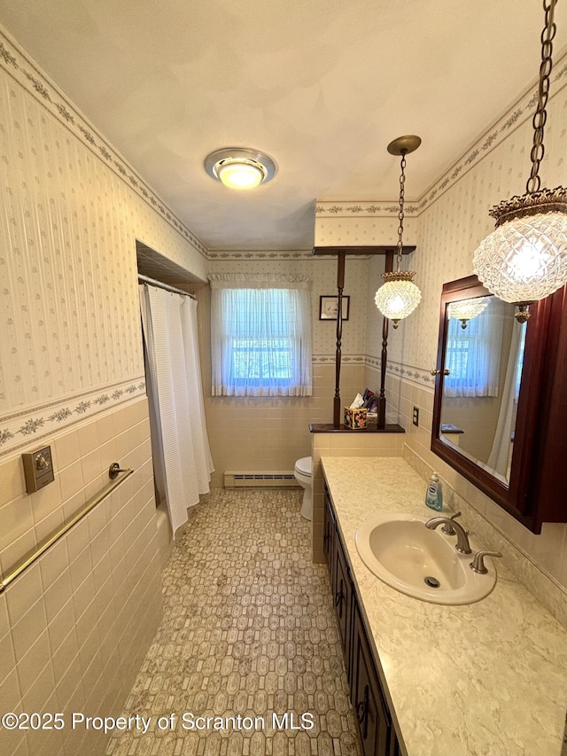 full bath with wallpapered walls, toilet, tile walls, and a baseboard heating unit