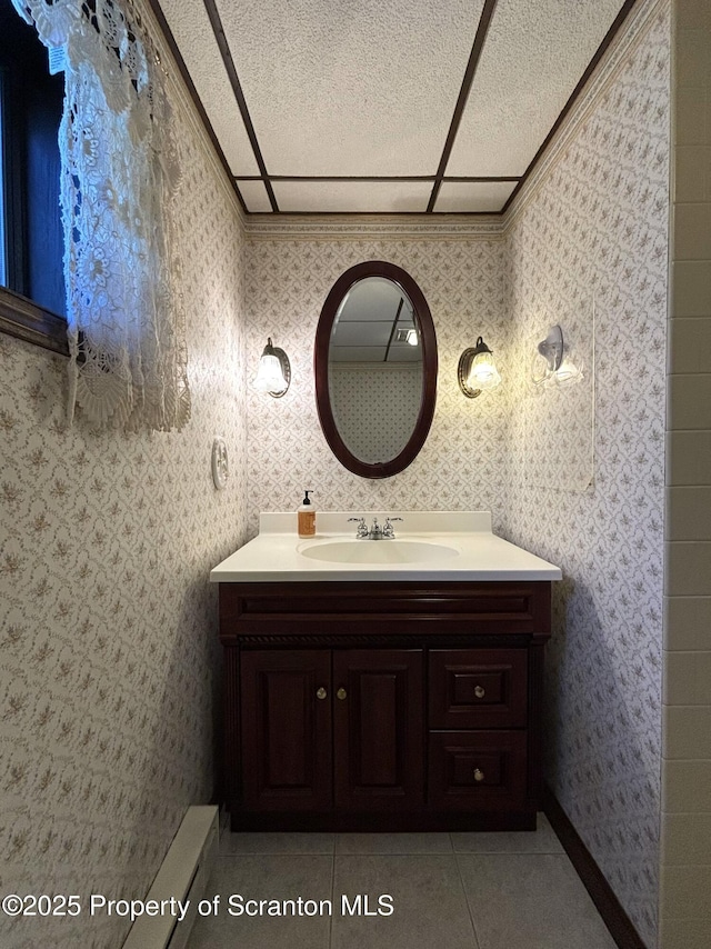 bathroom with vanity, wallpapered walls, and tile patterned floors
