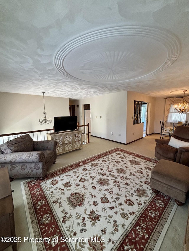 living room with an inviting chandelier and carpet