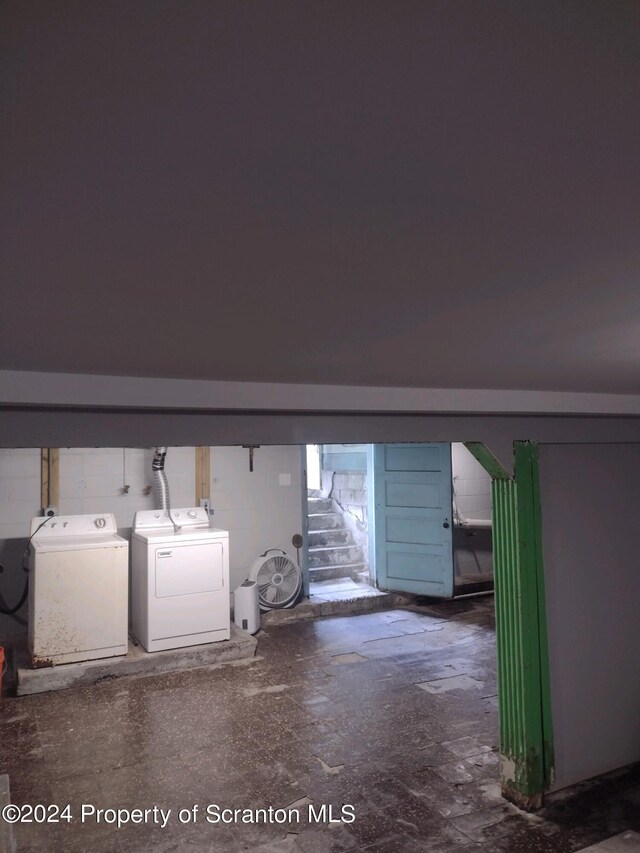 clothes washing area featuring washing machine and dryer