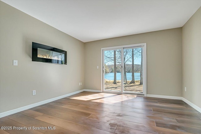 134 Laurel Hill Dr Unit 102, Greentown, PA 18426 - spare room featuring hardwood / wood-style flooring and baseboards
