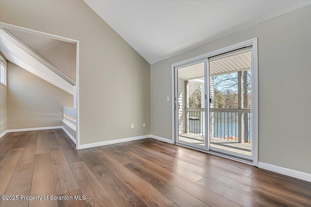 134 Laurel Hill Dr Unit 102, Greentown, PA 18426 - unfurnished room with lofted ceiling and hardwood / wood-style flooring