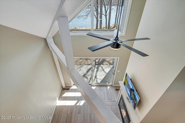134 Laurel Hill Dr Unit 102, Greentown, PA 18426 - detailed view of wood finished floors, ceiling fan, a glass covered fireplace, and nearby water