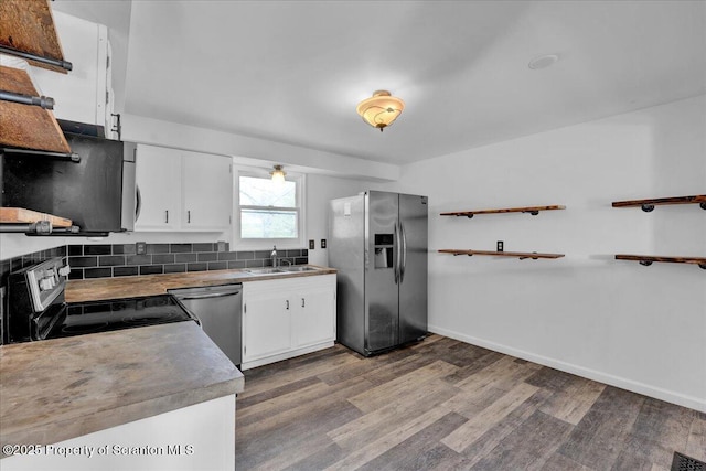 6 Eastview Dr, Scott Twp, PA 18411 - kitchen with appliances with stainless steel finishes, dark wood-type flooring, a sink, and white cabinetry