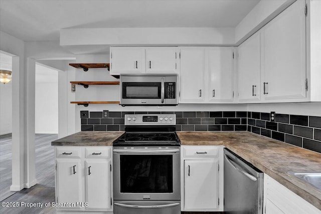 6 Eastview Dr, Scott Twp, PA 18411 - kitchen featuring appliances with stainless steel finishes, open shelves, white cabinetry, and decorative backsplash