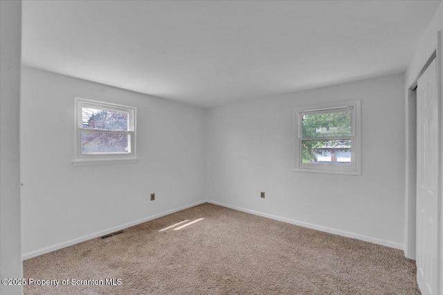 6 Eastview Dr, Scott Twp, PA 18411 - carpeted empty room featuring healthy amount of natural light and baseboards