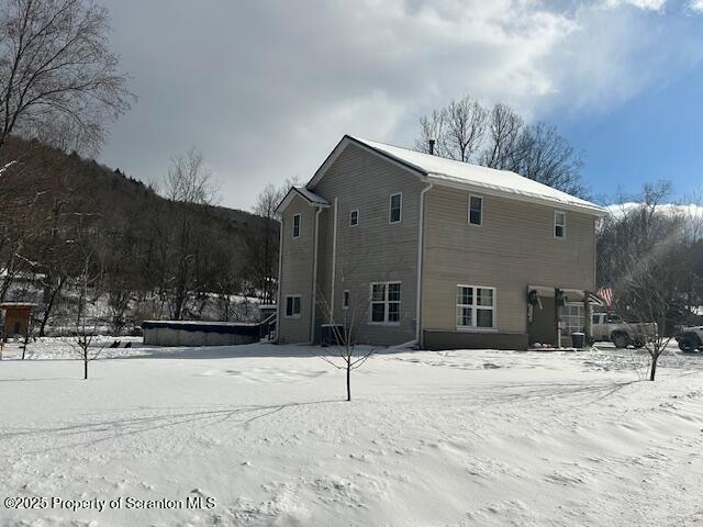 view of snow covered house