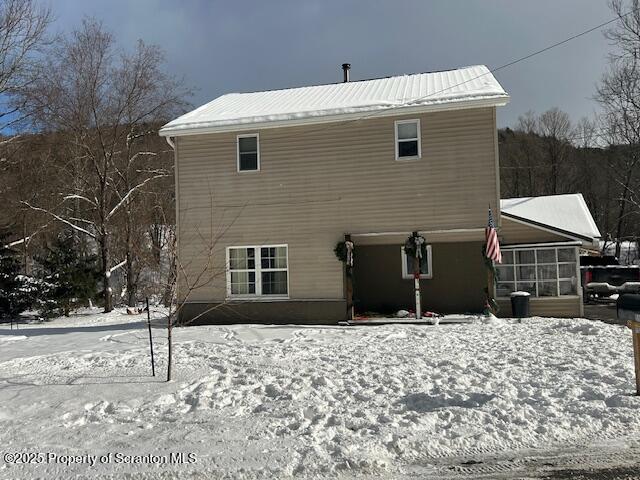 view of snow covered house