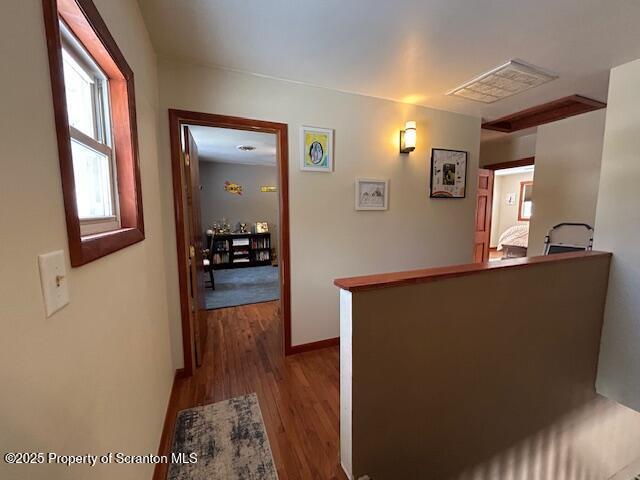 corridor featuring hardwood / wood-style floors