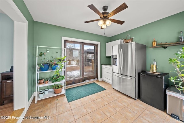 kitchen with stainless steel refrigerator, ceiling fan, light tile patterned flooring, and stainless steel refrigerator with ice dispenser