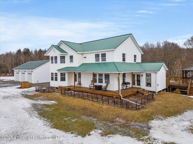 view of front of house with covered porch and a garage