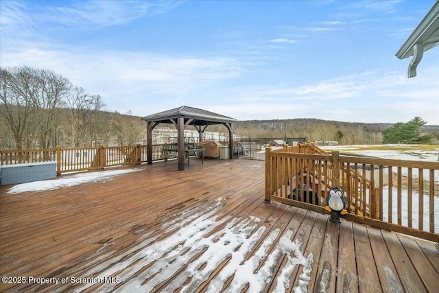 snow covered deck featuring a gazebo