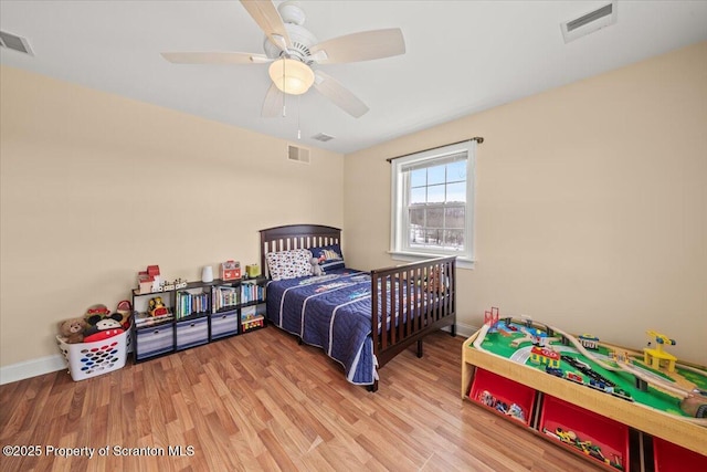 bedroom featuring light wood-type flooring and ceiling fan