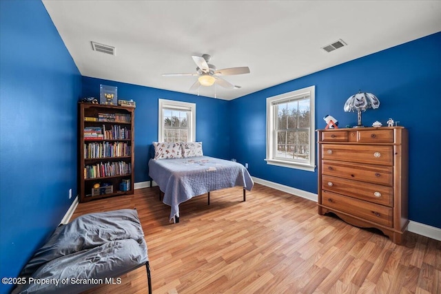 bedroom with light wood-type flooring and ceiling fan