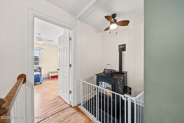 hallway with light hardwood / wood-style flooring