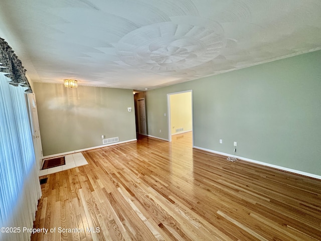 13 Forest Glen Dr, Scranton, PA 18504 - empty room featuring a chandelier and light wood finished floors