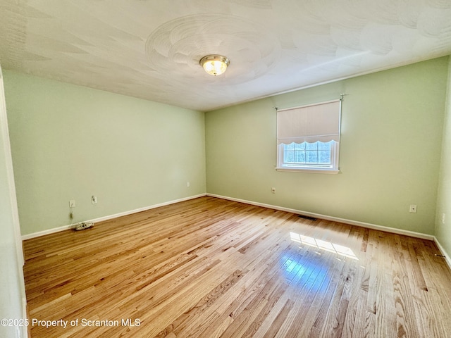 13 Forest Glen Dr, Scranton, PA 18504 - empty room featuring wood finished floors and baseboards