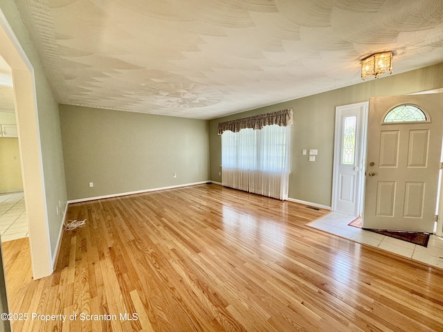 13 Forest Glen Dr, Scranton, PA 18504 - entryway with light wood finished floors, plenty of natural light, and a chandelier