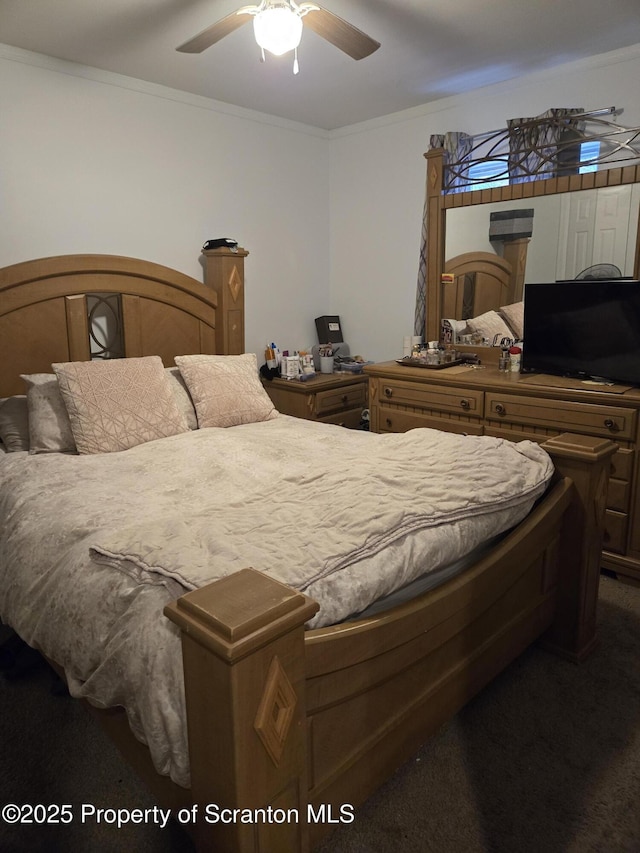 bedroom with ceiling fan, carpet, and ornamental molding