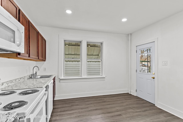 37 Goeringer Ave, Hanover Twp, PA 18706 - kitchen featuring white appliances, baseboards, dark wood-type flooring, light countertops, and a sink