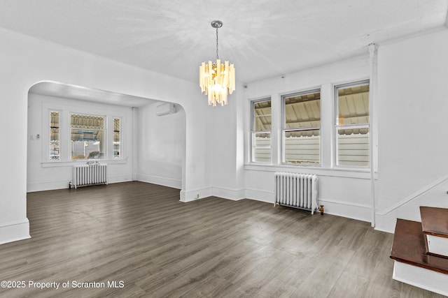 37 Goeringer Ave, Hanover Twp, PA 18706 - unfurnished dining area with arched walkways, a wealth of natural light, and radiator