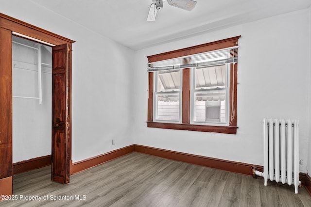 37 Goeringer Ave, Hanover Twp, PA 18706 - unfurnished bedroom with ceiling fan, radiator, baseboards, and wood finished floors