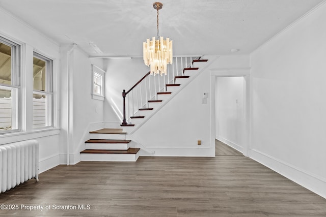 37 Goeringer Ave, Hanover Twp, PA 18706 - stairs with ornamental molding, radiator, wood finished floors, and a notable chandelier