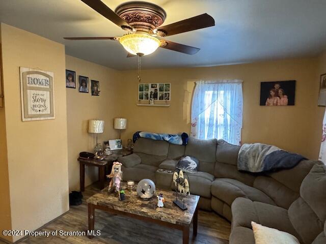 living room featuring ceiling fan