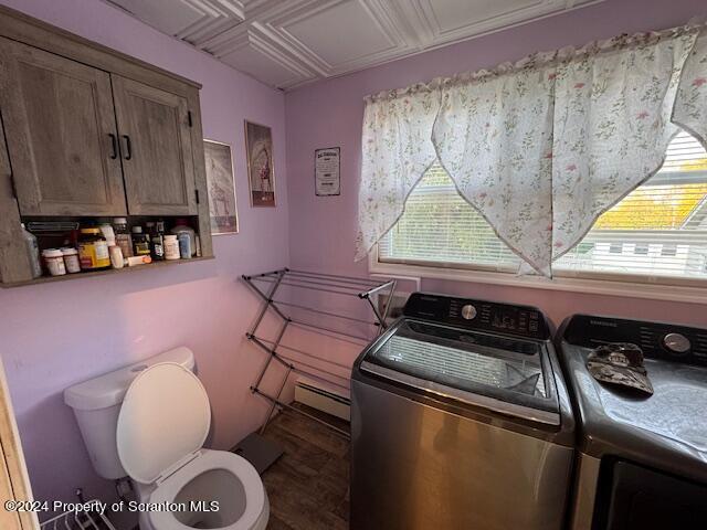 washroom with separate washer and dryer and baseboard heating