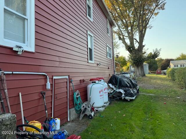 view of home's exterior with a lawn