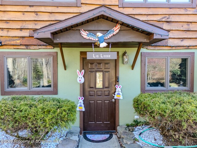 125 Frances Ln, Greentown, PA 18426 - view of exterior entry featuring stucco siding
