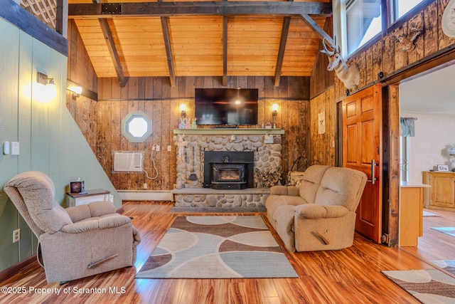 125 Frances Ln, Greentown, PA 18426 - living area with wood walls, wood finished floors, beam ceiling, and plenty of natural light