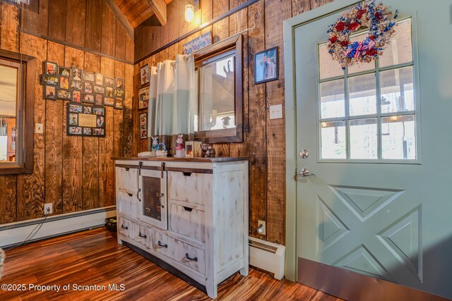 125 Frances Ln, Greentown, PA 18426 - bathroom featuring baseboard heating, wood finished floors, a baseboard heating unit, vanity, and wooden walls