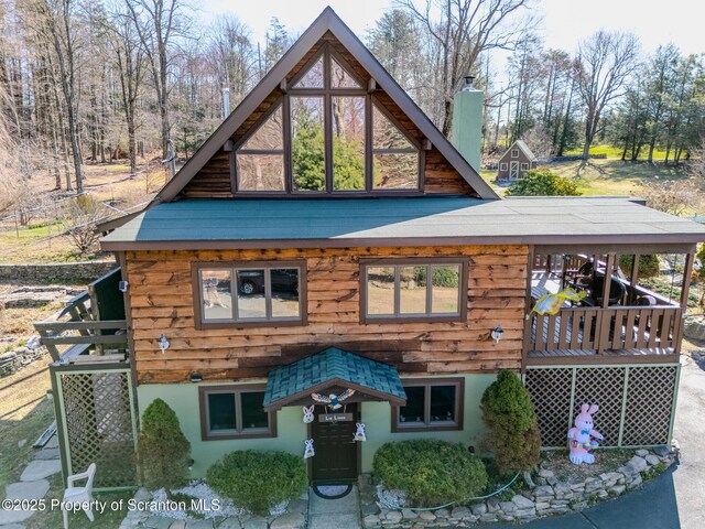 125 Frances Ln, Greentown, PA 18426 - rear view of house with a chimney and stucco siding