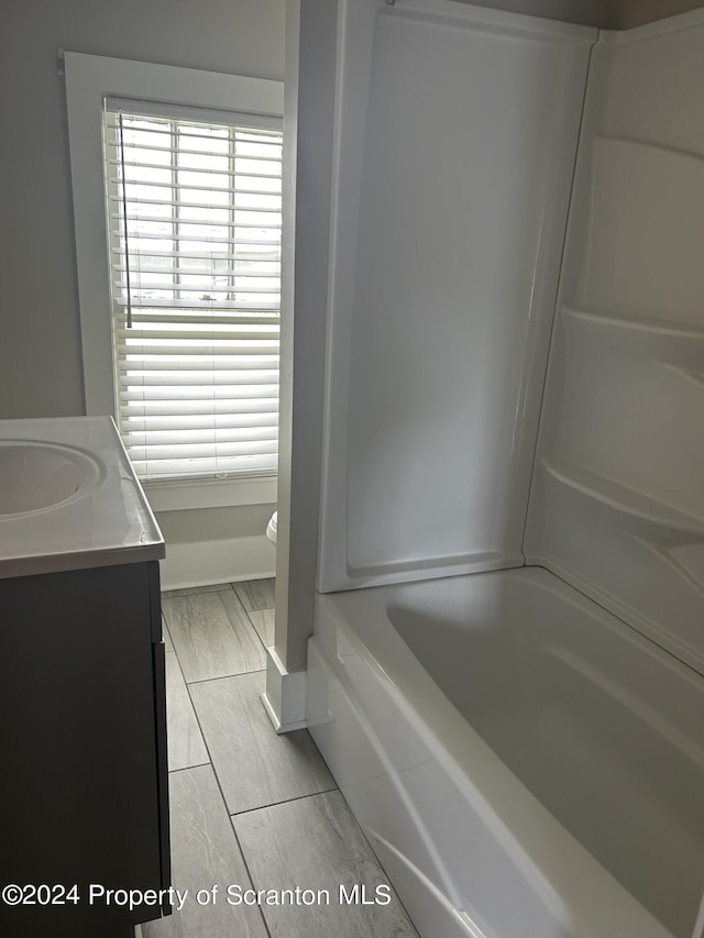 bathroom with tile patterned floors, vanity, and toilet