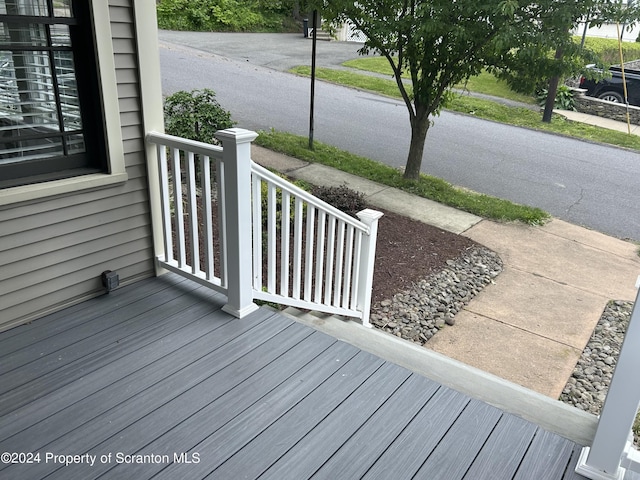 wooden deck featuring covered porch