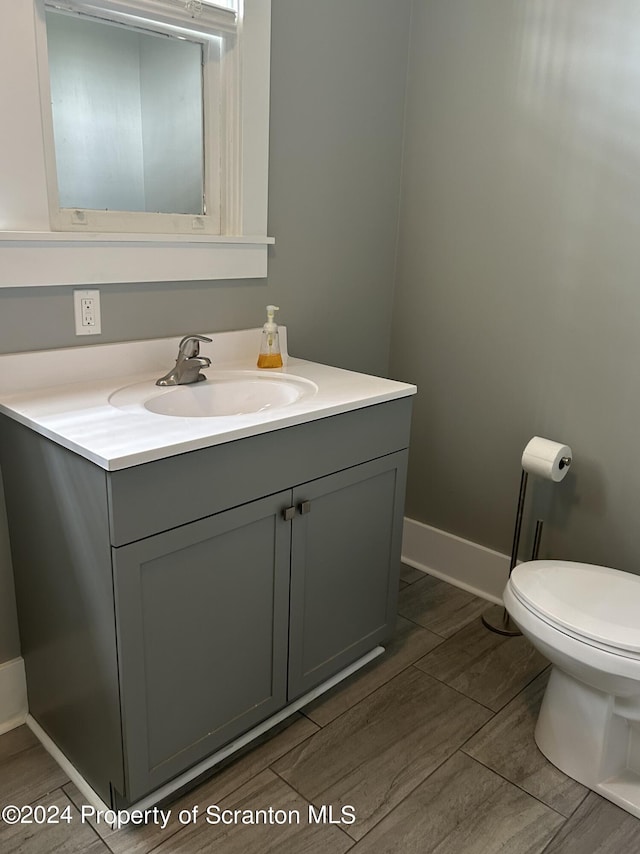 bathroom with vanity and toilet