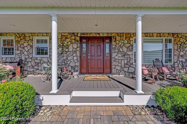 property entrance with a porch