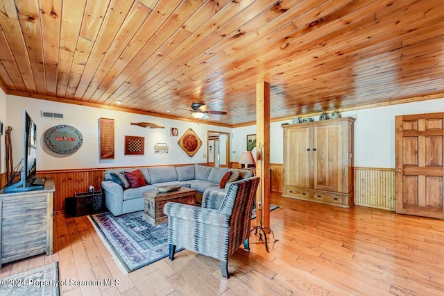 living room with light hardwood / wood-style flooring, ceiling fan, crown molding, and wood ceiling