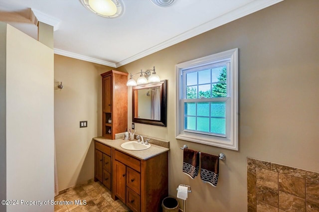 bathroom featuring vanity and crown molding