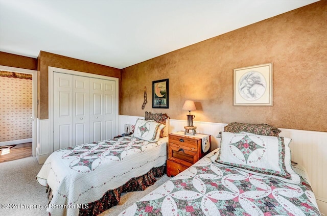 carpeted bedroom with a closet