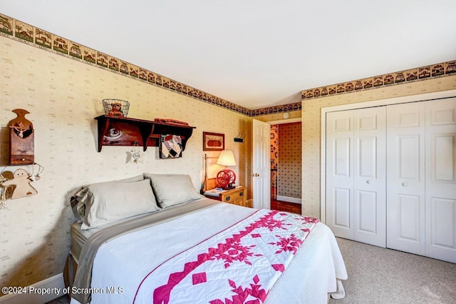 bedroom featuring a closet and carpet floors