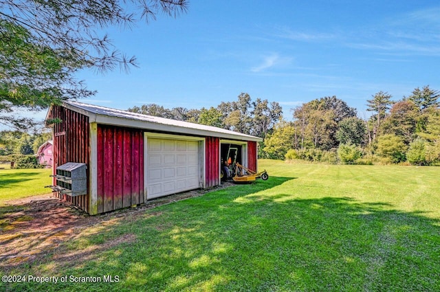 garage featuring a yard