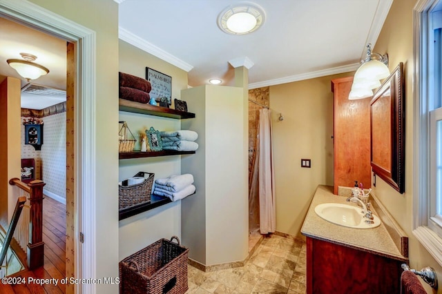 bathroom with vanity, walk in shower, and ornamental molding