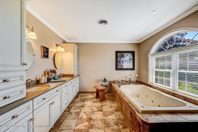 bathroom featuring vanity, ornamental molding, and tiled tub