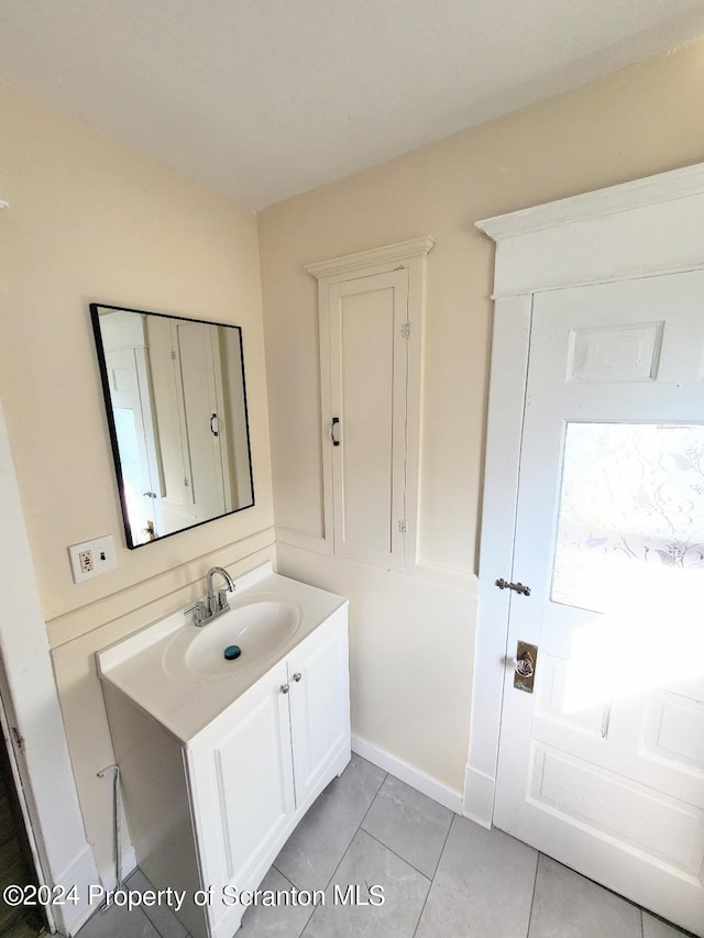 bathroom with vanity and tile patterned floors