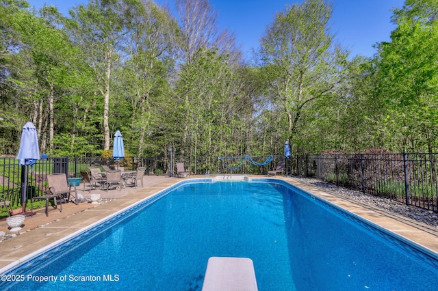 157 Mcesther Dr Unit L 31, Covington Twp, PA 18424 - view of pool featuring a diving board and a patio