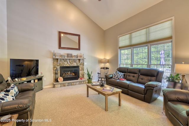 157 Mcesther Dr Unit L 31, Covington Twp, PA 18424 - living area featuring carpet, high vaulted ceiling, and a stone fireplace